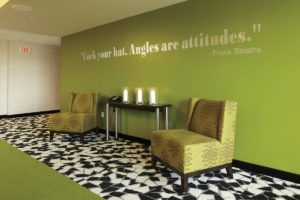 Interior of C Hotel with customized floor with wall quote