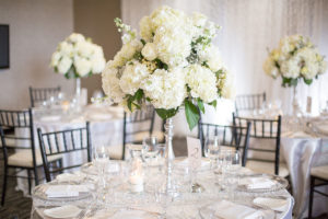 A Wedding Table Setup on Dolce Rooftop Showing White Flowers and Glasses