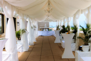 A View of Dolce Rooftop decorated with white south beach inspired theme for a wedding ceremony